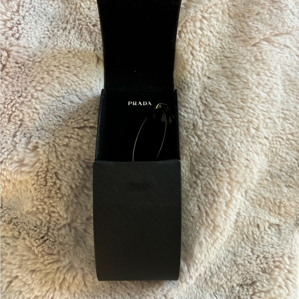 Prada round sunglasses in gold